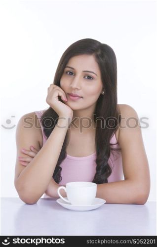 Portrait of woman with cup of coffee