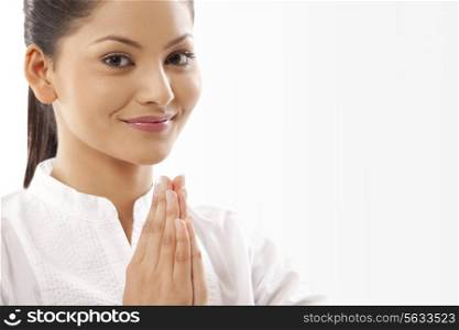 Portrait of woman with hands clasped doing yoga