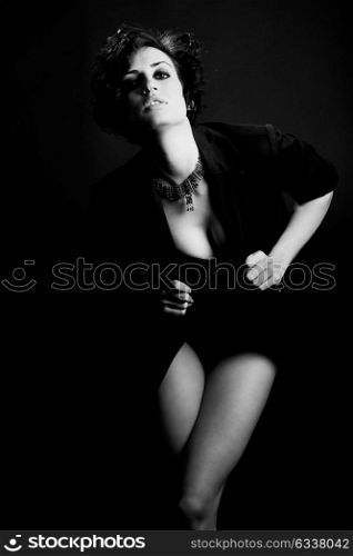 Portrait of woman with intense look on black background