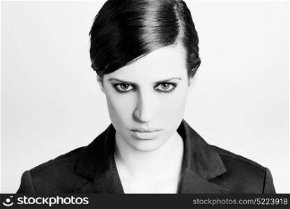Portrait of woman with intense look on white background. Studio portrait