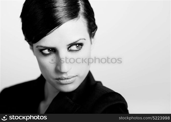 Portrait of woman with intense look on white background. Studio portrait