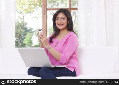 Portrait of woman with mobile phone