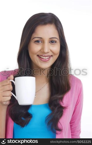 Portrait of woman with mug of tea