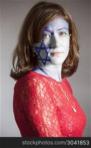 Portrait of woman with painted Flag of Israel. Portrait of woman with painted Flag of Israel on a gray background
