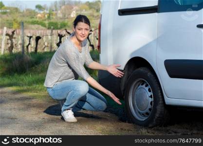 portrait of woman with puncture in rural setting