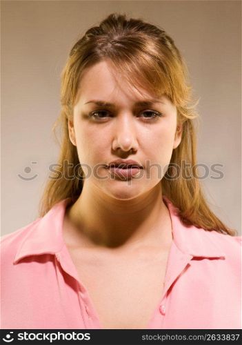 Portrait of woman with serious and concerned expression
