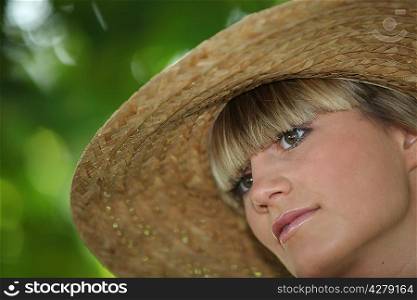 Portrait of woman with straw hat