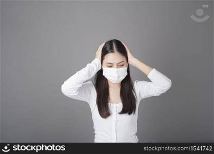 Portrait of woman with surgical mask in studio, Health care concept