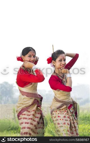 Portrait of women performing Bihu dance