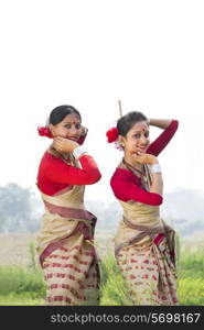 Portrait of women performing Bihu dance