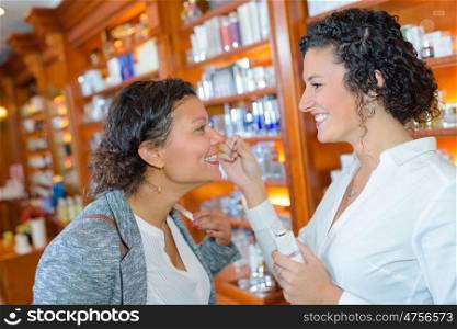 portrait of women smelling the perfume