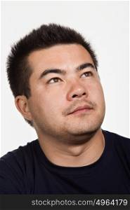 Portrait of young adult Asian man