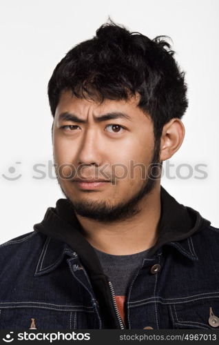 Portrait of young adult Asian man