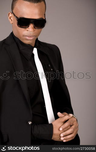 Portrait of young african business man in formal clothing on a grey background