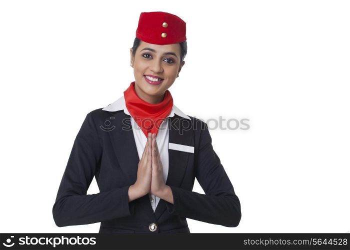 Portrait of young airhostess greeting Namaste isolated over white background
