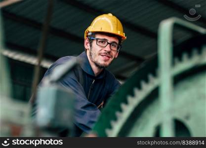 Portrait of young American happy worker enjoy happy smiling to work in a heavy industrial factory.