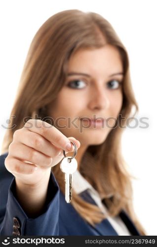 Portrait of Young and beautiful business woman holding keys - Focus is on the keys