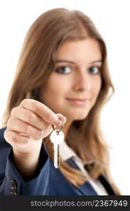 Portrait of Young and beautiful business woman holding keys - Focus is on the keys