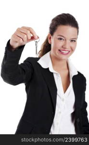 Portrait of Young and beautiful businesswoman holding keys, focus is on the keys