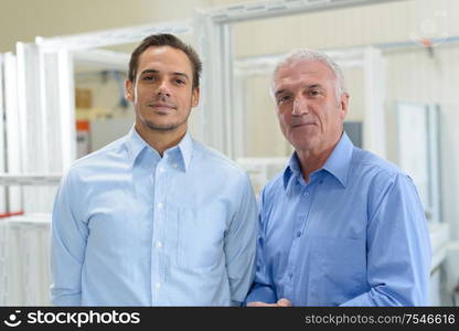 portrait of young and senior businessman