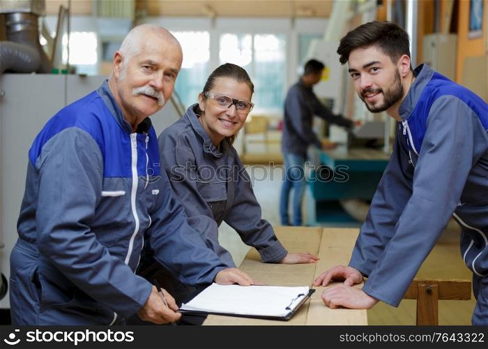 portrait of young apprentices in carpentry school
