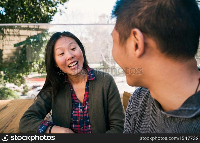 Portrait of young Asian couple enjoying a date and spending good time together Love concept.