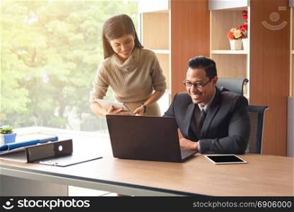 Portrait of young asian professional businesspeople, man and woman, in office