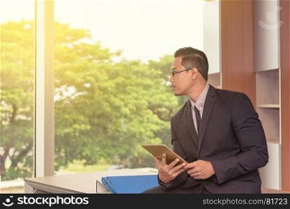 Portrait of young asian smart professional business man in office