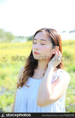 Portrait of Young Asian woman girl smile in flower garden