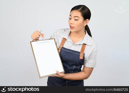 Portrait of young asian woman in waitress uniform holding mock up clipboard with pen, copy space to insert text for advertisement isolated on white background