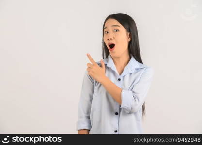 Portrait of young asian woman pointing with two hands and fingers to the side over isolated white background. Advertising and lifestyle concept.