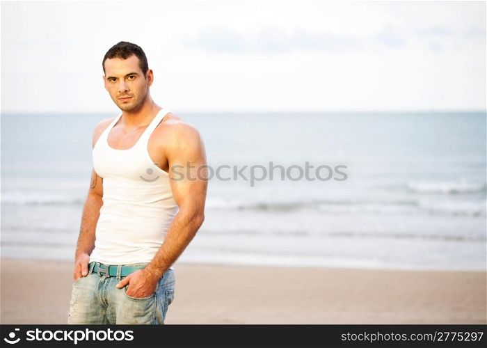 Portrait of young athlete on beach