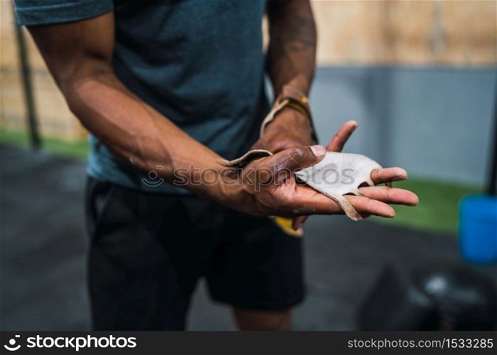 Portrait of young athletic man getting ready for crossfit training. Sport and healthy lifestyle concept.