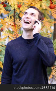 Portrait of young attractive man calling by phone