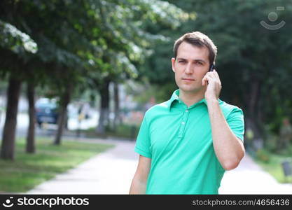 Portrait of young attractive man calling by phone