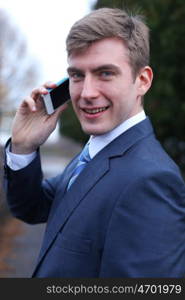 Portrait of young attractive man calling by phone