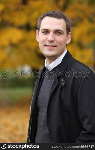 Portrait of young attractive man, outdoors