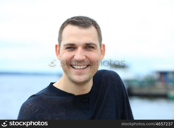 Portrait of young attractive man, outdoors