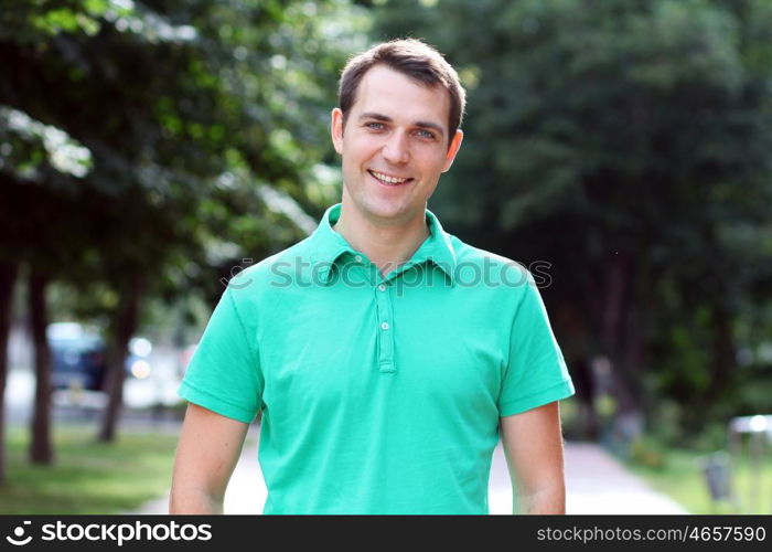 Portrait of young attractive man, outdoors