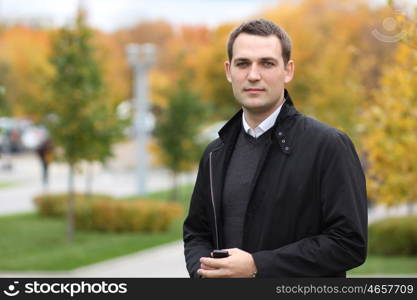 Portrait of young attractive man, outdoors