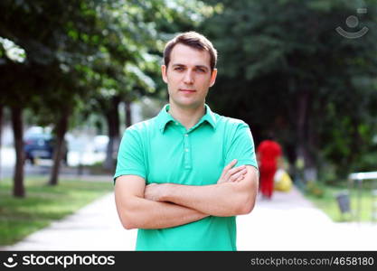 Portrait of young attractive man, outdoors