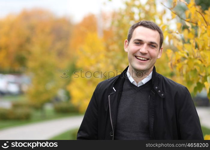 Portrait of young attractive man, outdoors