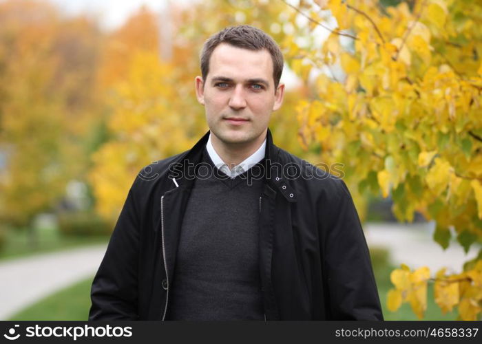 Portrait of young attractive man, outdoors