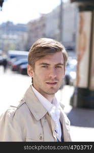 Portrait of young attractive man, outdoors