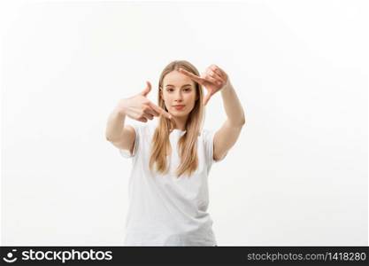 Portrait of young beautiful caucasian woman with cheerfuly smiling making a camera frame with fingers. Isolated on white background. Copy space. Portrait of young beautiful caucasian woman with cheerfuly smiling making a camera frame with fingers. Isolated on white background. Copy space.