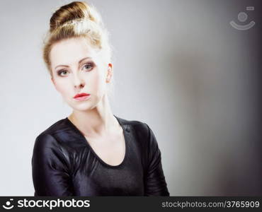 Portrait of young beautiful girl blonde make up and hair bun