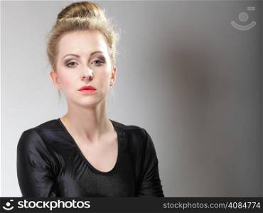 Portrait of young beautiful girl blonde make up and hair bun