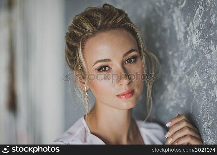 Portrait of young beautiful girl in a negligee.. Close-up portrait of young beautiful girl 121.