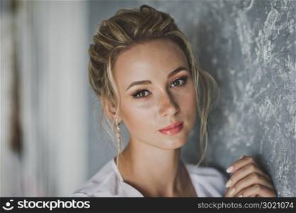 Portrait of young beautiful girl in a negligee.. Close-up portrait of young beautiful girl 121.