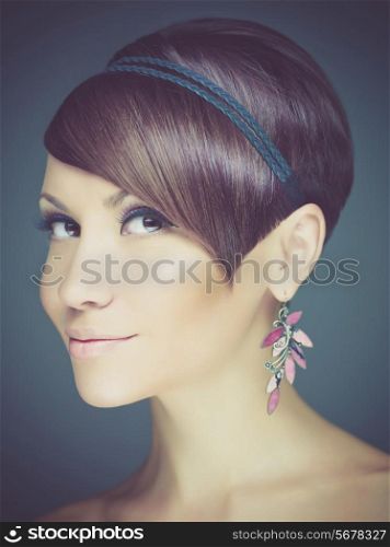 Portrait of young beautiful lady with earring
